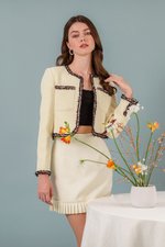 EMIRI PLEATED HEM MINI SKIRT