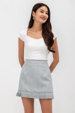 EMIRI PLEATED HEM MINI SKIRT