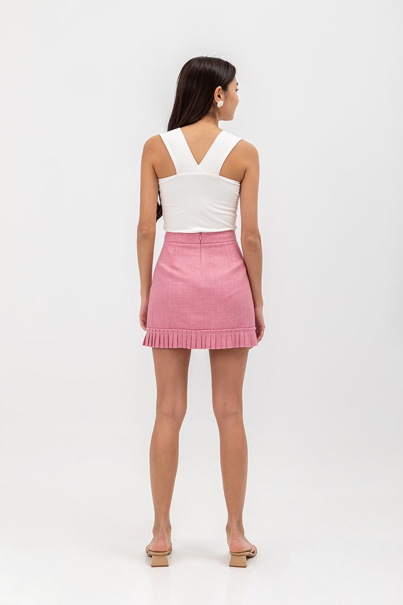 EMIRI PLEATED HEM MINI SKIRT