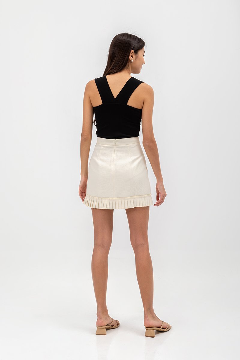 EMIRI PLEATED HEM MINI SKIRT