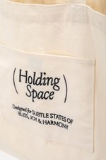 HOLDING SPACE TOTE BAG