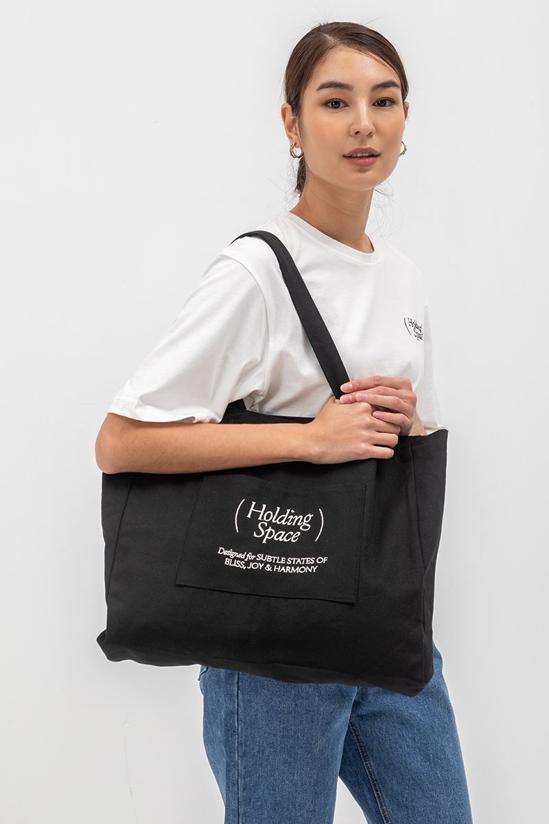 HOLDING SPACE TOTE BAG