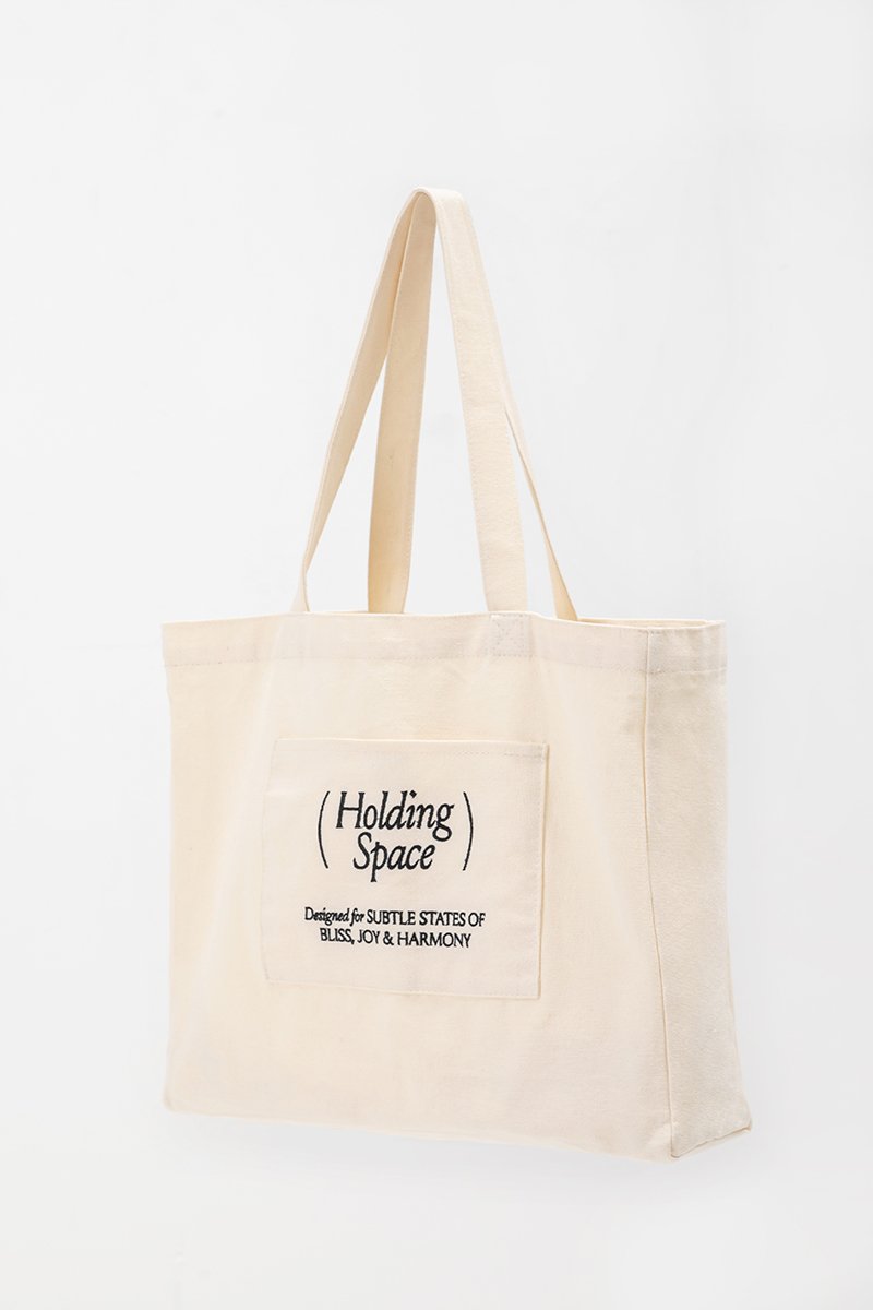 HOLDING SPACE TOTE BAG