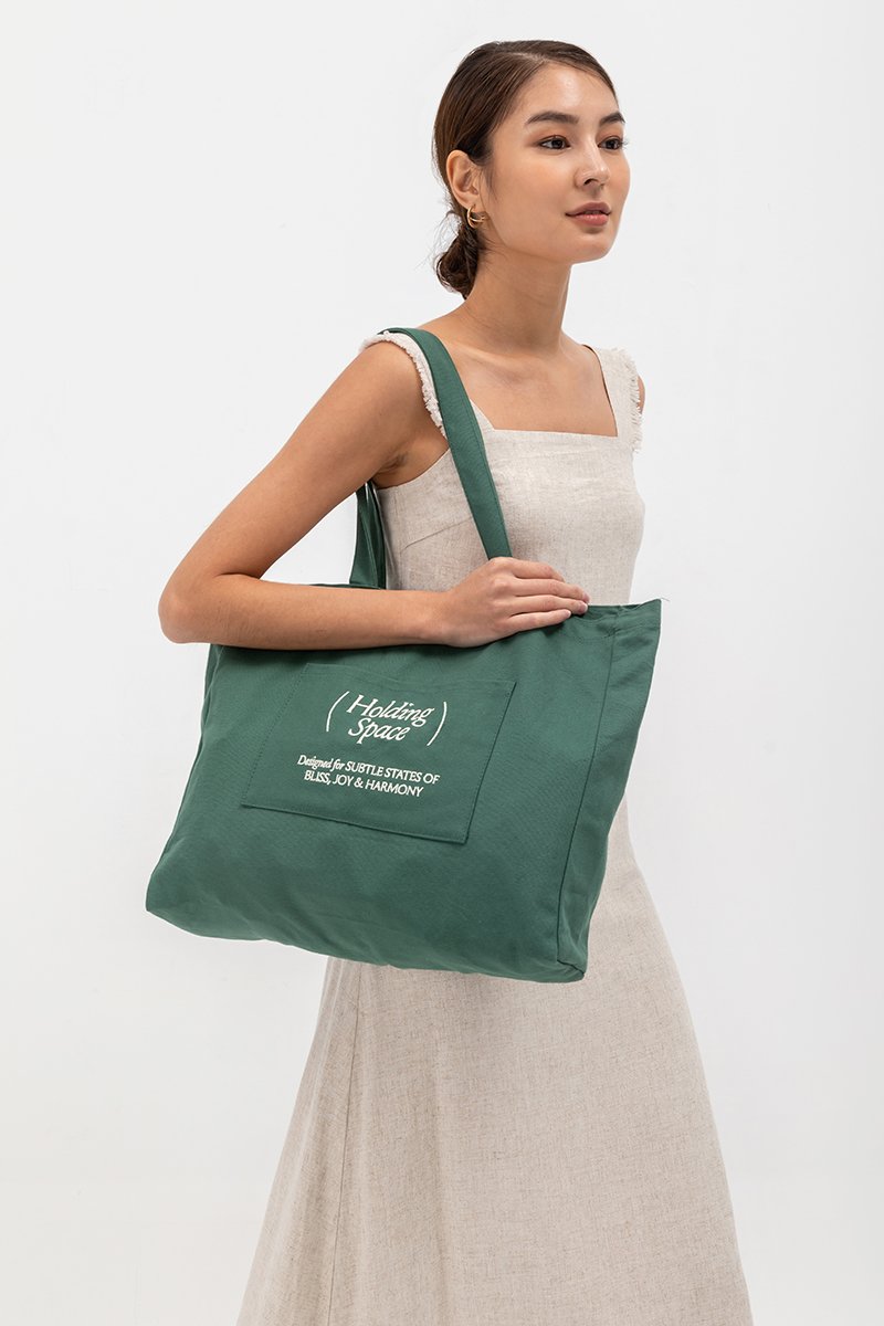 HOLDING SPACE TOTE BAG