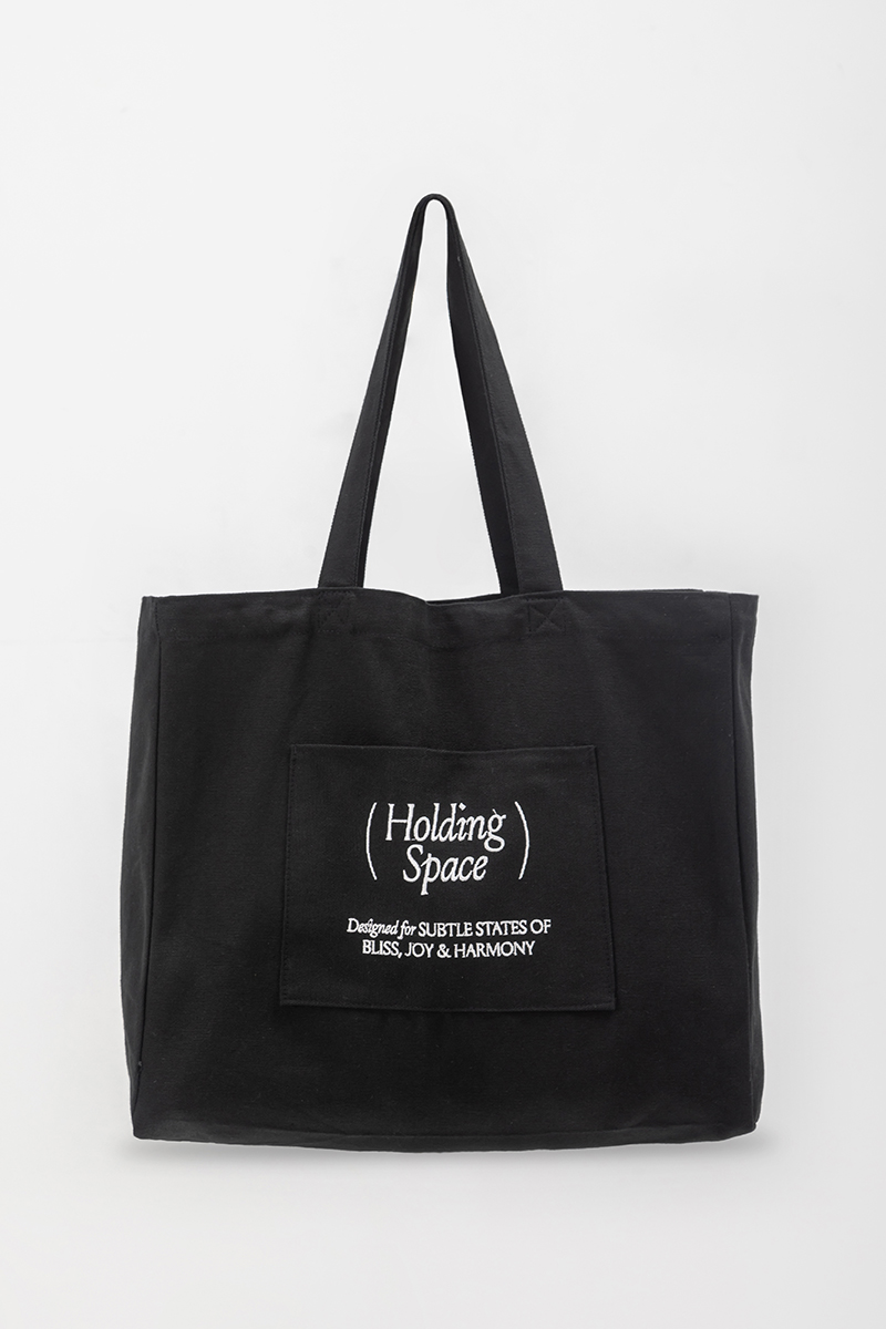 HOLDING SPACE TOTE BAG