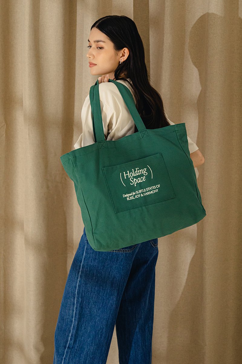 HOLDING SPACE TOTE BAG