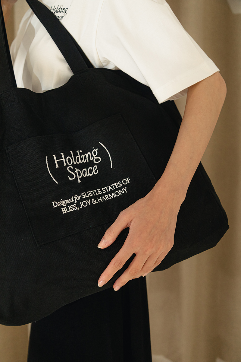 HOLDING SPACE TOTE BAG